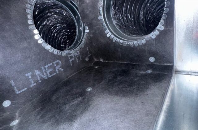 Dust and buildup around a flexible duct opening before cleaning